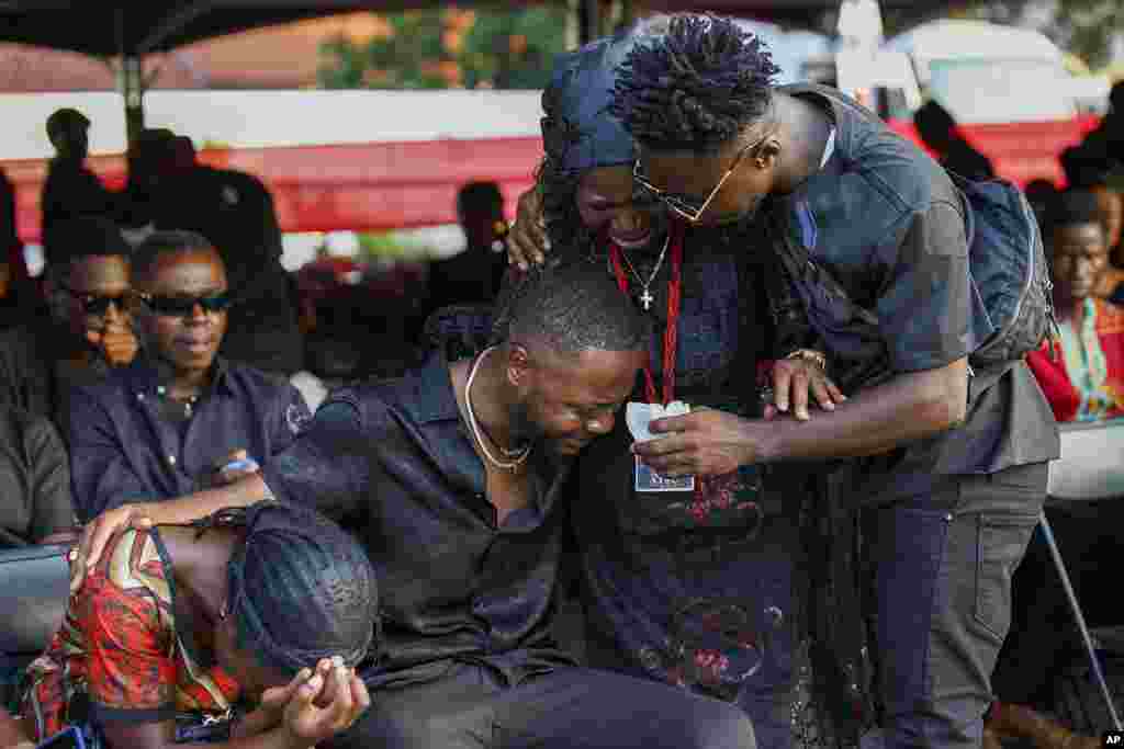 Relatives of Ghana soccer player Christian Atsu weep during his funeral at the State House in Accra, Ghana.&nbsp;Atsu, who played for Premier League teams Chelsea and Newcastle, before joining Turkish club Hatayspor last year, was found dead in his collapsed apartment building in the Turkey earthquake.