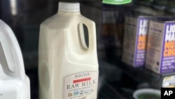 A bottle of raw milk is displayed for sale at a store in Temecula, Calif., on May 8, 2024. 
