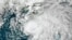 FILE - This satellite image taken July 6, 2021, and provided by NOAA, shows a tropical storm off the coast of Florida. On April 13, 2023, the National Oceanic and Atmospheric Administration said indications were favorable for an El Nino pattern to form in the next six months.