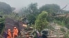 Tim SAR mencari korban di lokasi tanah longsor yang melanda sebuah desa di Pulau Serasan, Kabupaten Natuna, Senin, 6 Maret 2023. (BNPB via AP)