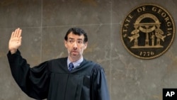 FILE - Fulton County Superior Court Judge Robert McBurney swears in potential jurors during proceedings to seat a special purpose grand jury in Atlanta, Georgia, May 2, 2022.