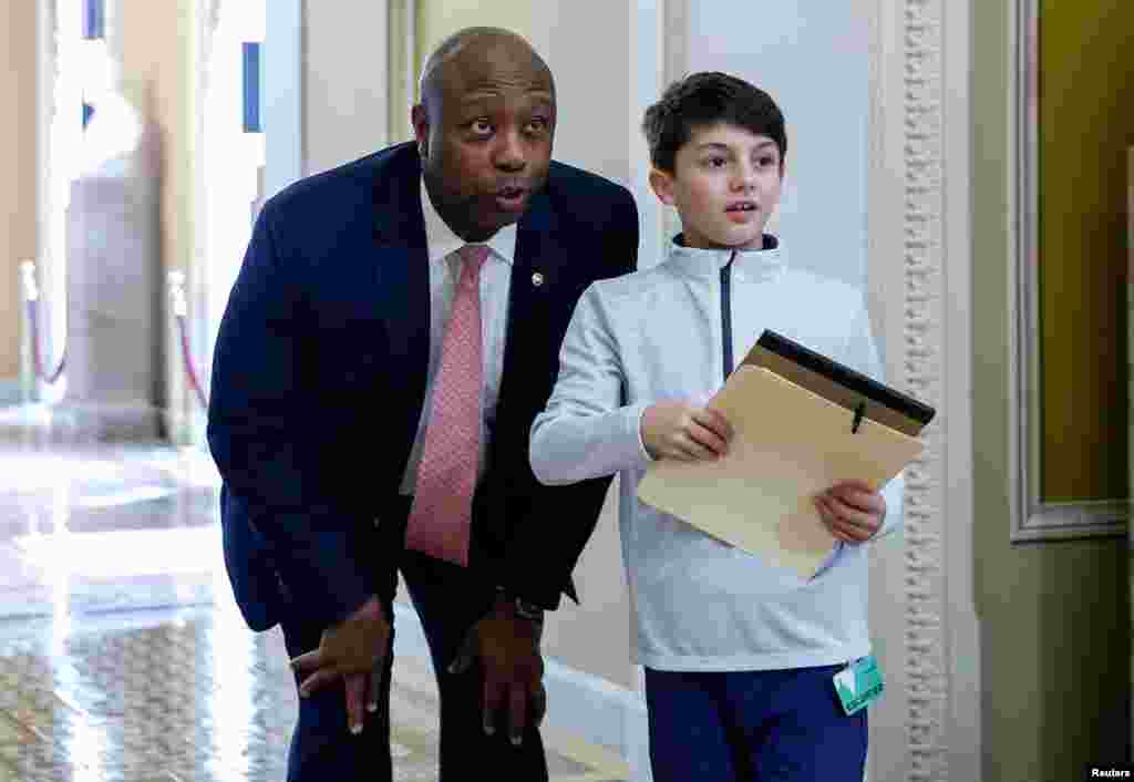 Senator Tim Scott (R-SC) looks into the Senate chamber as he gives a tour of the Senate as Senators are sworn in as jurors to decide whether the Senate will hold a full trial after receiving the two articles of impeachment against Department of Homeland Security Secretary Alejandro Mayorkas,&nbsp;on Capitol Hill in Washington, April 17, 2024.