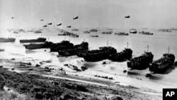 (FILE) This is the scene along a section of Omaha Beach in June 1944, during the Allied invasion at the Normandy coast in France during World War II. 