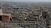 (FILE) A view shows houses destroyed in past Islamic State militant attacks, in the town of Sinjar, Iraq January 24, 2022.