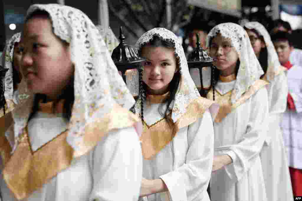 Altar servers wait for the Christmas Mass at Jakarta Cathedral in Jakarta on December 25, 2023.&nbsp;