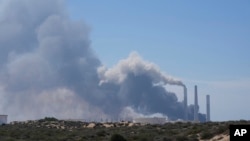 Smoke rises from an area near a power plant outside Ashkelon, Israel, Oct. 7, 2023. The U.N. Office for the Coordination of Humanitarian Affairs said Israeli authorities have ceased supplying electricity to the Gaza Strip.