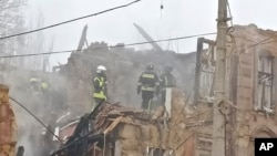 Rescuers work on a site of an apartment building damaged after a Russian attack in Odesa, Ukraine, Dec. 29, 2023.