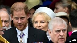 Britain's Prince Harry, Duke of Sussex, and Prince Andrew leave Westminster Abbey following the coronation of Britain's King Charles and Queen Camilla, in London, May 6, 2023.