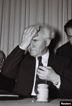 Israel's first Prime Minister David Ben-Gurion wipes his forehead just before the reading of Israel's declaration of Independence in Tel Aviv May 14, 1948, in this handout picture released April 28, 2008 by the Israeli Government Press Office (GPO). 