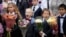 First-graders take part in a ceremony marking the start of classes at a school as part of the traditional opening of the school year known as 'Day of Knowledge' in St. Petersburg, Russia, Sept. 1, 2023. 