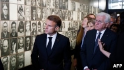 French President Emmanuel Macron (L) and German President Frank-Walter Steinmeier visit the memorial center during the 80th anniversary of the massacre of 643 persons by Nazi German forces, in Oradour-sur-Glane, France, on June 10, 2024. 