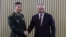 In this photo released by Russian Defense Ministry Press Service, Russian Defense Minister Sergei Shoigu, right, and Chinese Defense Minister Li Shangfu pose for a photo at the International Military Forum Army in Russia, Aug. 15, 2023.