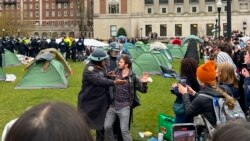FILE - Police officers arrest a protester who participated in an encampment on the Columbia University campus in New York, April 18, 2024.