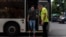 Accompanied by trainer Vasyl Hoshovskyi, Ivan Soroka, a former Ukrainian soldier blinded in the war, gets off a bus in Rivne, Ukraine,