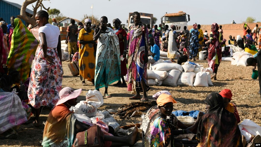 FILE - Internally displaced women wait for food rations to be distributed by the World Food Program in Bentiu, South Sudan, Feb. 6, 2023.