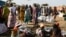 FILE - Internally displaced women wait for food rations to be distributed by the World Food Program in Bentiu, South Sudan, Feb. 6, 2023.