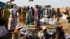 FILE - Internally displaced women wait for food rations to be distributed by the World Food Program in Bentiu, South Sudan, Feb. 6, 2023. Attacks on humanitarian aid workers have complicated the already dire food crisis in the country.