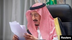 FILE - Saudi King Salman bin Abdulaziz gives virtual speech during the first session of Shura council, from his palace in NEOM, Saudi Arabia, Nov. 11, 2020. (Bandar Algaloud/Courtesy of Saudi Royal Court/Handout via Reuters)
