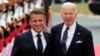 US President Joe Biden, right, and French President Emmanuel Macron arrive at the international ceremony at Omaha Beach, June 6, 2024, in Normandy, France. 