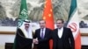 Wang Yi, diplomat senior China (tengah), Ali Shamkhani, Sekretaris Dewan Keamanan Nasional Tertinggi Iran dan Menteri Negara (kanan) dan Penasihat Keamanan Nasional Arab Saudi Musaad bin Mohammed Al Aiban dalam pertemuan di Beijing, China, 10 Maret 2023. (China Daily via REUTERS)