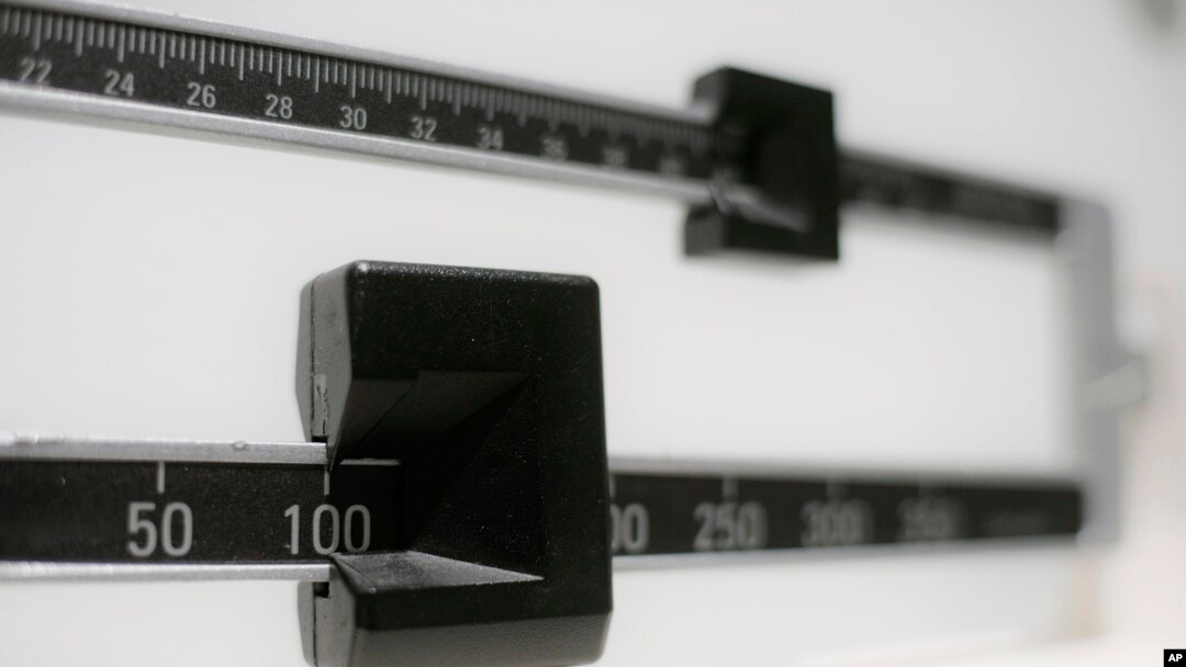 FILE- A close-up of a beam scale is seen in New York, April 3, 2018. 