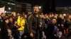 Demonstrators shout anti-government slogans during a protest in front of the parliament, in Athens, March 3, 2023.