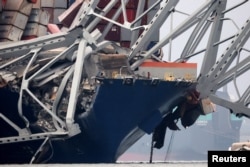 A view of the Dali cargo vessel which crashed into the Francis Scott Key Bridge causing it to collapse in Baltimore, March 27, 2024.