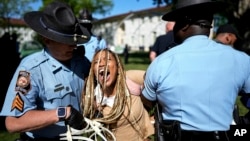 FILE—Georgia State Patrol officers detain a demonstrator on the campus of Emory University during a pro-Palestinian demonstration, April 25, 2024, in Atlanta.