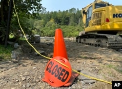 A closed flood-damaged trail is shown Aug. 14, 2024, at Kingdom Trails in Burke, Vt.