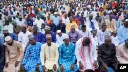 FILE - Nigerian Muslim attend Eid al-Adha prayers at an open field in Lagos, Nigeria on Wednesday, June 28, 2023.