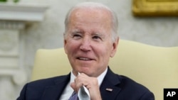 President Joe Biden listens as he meets with Colombian President Gustavo Petro in the Oval Office of the White House in Washington, April 20, 2023. 