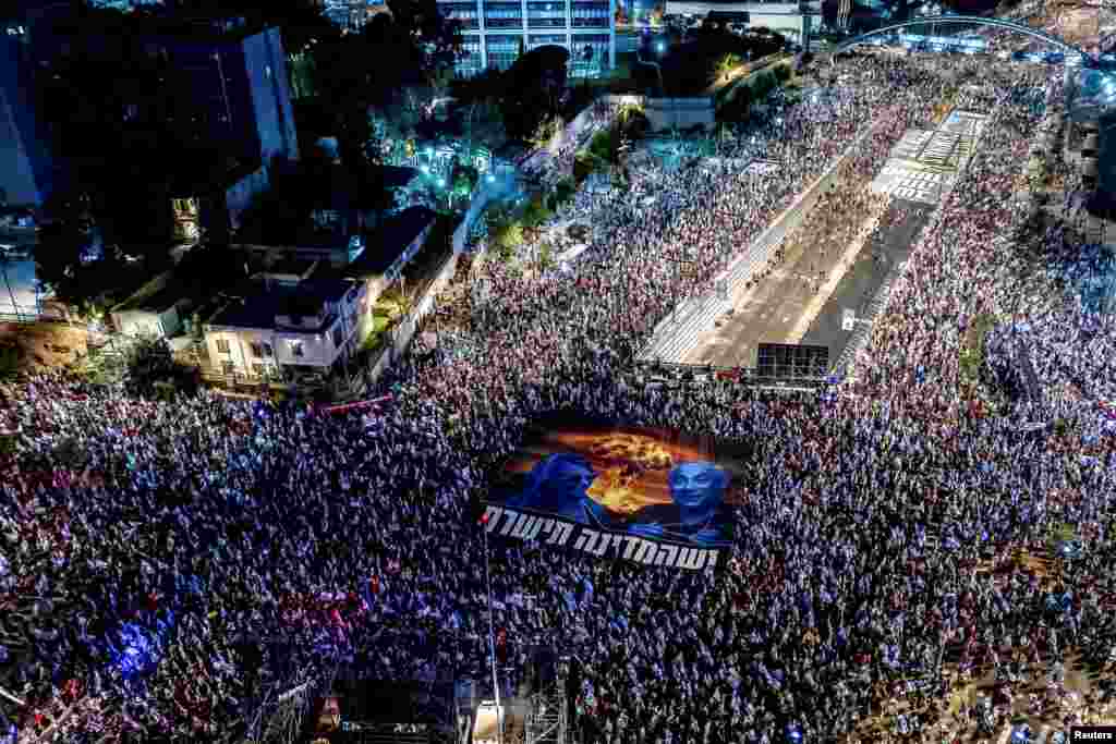 Israelis take part in a demonstration against Prime Minister Benjamin Netanyahu and his nationalist coalition government's judicial overhaul, in Tel Aviv, Aug. 26, 2023. 