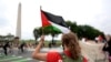 A demonstrator waves a Palestinian flag near the Washington Monument during a protest during the visit of Israeli Prime Minister Benjamin Netanyahu to the White House in Washington, July 25, 2024.