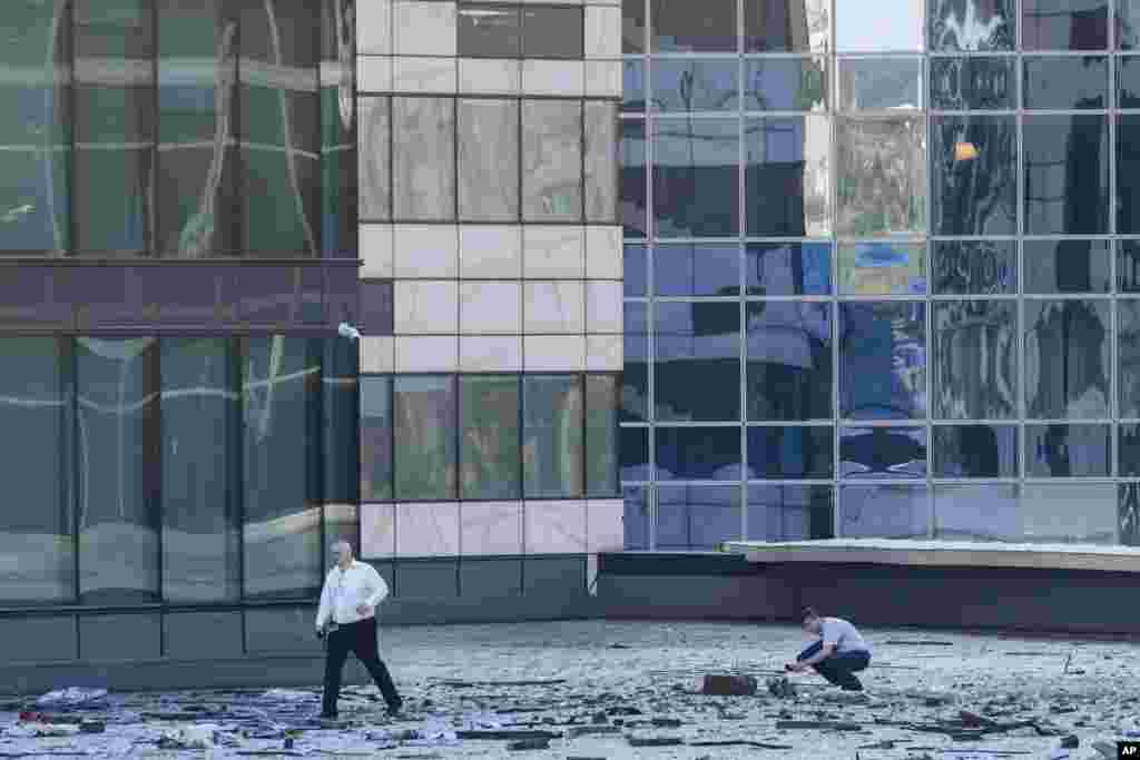 Investigators examine a damaged building in the Moscow City business district after a reported drone attack in Moscow, Russia.&nbsp;Ukrainian drones again targeted Moscow and its surroundings, the Russian military reported.