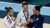 (LtoR) China's Qiu Qiyuan (silver), Algeria's Kaylia Nemour (gold), US' Sunisa Lee (bronze) pose during the podium ceremony for the artistic gymnastics women's uneven bars event of the Paris 2024 Olympic Games, Aug. 4, 2024. 