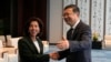 Shanghai Party Secretary Chen Jining gestures as he shakes hands with U.S. Commerce Secretary Gina Raimondo before a meeting in Shanghai, China, on Aug. 30, 2023.