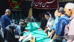 Iranian Jews are photographed by Iranian state media voting at Isfahan's Al Aqsa Mosque in the second round of the Iranian presidential election on July 5, 2024. The ballot box can be seen in the center of the image. (Source: IMNA) 