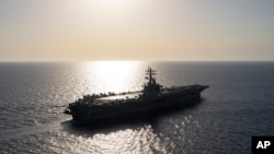 FILE - The USS aircraft carrier Dwight D. Eisenhower sails in the Red Sea, June 12, 2024. U.S. officials have ordered the vessel, which as been leading America's response to the Houthi attacks, to return home. 