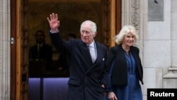 Britain's King Charles leaves the London Clinic with Britain's Queen Camilla after receiving treatment for an enlarged prostate in London, Jan. 29, 2024. 