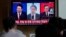 A TV screen shows file images of South Korean President Yoon Suk Yeol, left, Japanese Prime Minister Fumio Kishida and Chinese Premier Li Qiang, right, during a news program at the Seoul Railway Station in Seoul, South Korea, Thursday, May 23, 2024. 