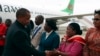 Malawi Vice President Saulos Chilima, left, greets government officials upon his return from South Korea in Lillongwe, June 9, 2024.