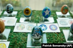 FILE - Decorative eggs designed by students from the United States' 56 states and territories are on display in the White House, April 6, 2023, in Washington. (AP Photo/Patrick Semansky)