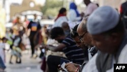 FILE - Passengers fleeing war-torn Sudan arrive at Qastal land port crossing between Egypt and Sudan on May 13, 2023. 