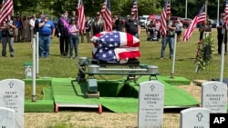 Former U.S. Marine Gerry Brooks is laid to rest at the Maine Veterans Memorial Cemetery in Augusta, Maine, June 20, 2024.