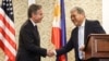 U.S. Secretary of State Antony Blinken, left, shakes hands with Philippine Foreign Minister Enrique Manalo during a joint news conference in Manila, Philippines, March 19, 2024.