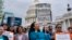 Analilia Mejia of the Center for Popular Democracy, center, joins other activists calling for ethics reform in the U.S. Supreme Court, at the Capitol in Washington, May 2, 2023. 
