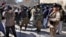 Afghan cameramen cover a protest against U.S. President Joe Biden in Kabul, Feb. 15, 2022. The country currently ranks as third worst for media, coming in at 178th out of 180 on the World Press Freedom Index. 