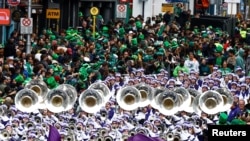 People attend the St. Patrick&#39;s Day parade in Dublin, Ireland.