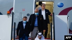 US citizens Siamak Namazi (R-back), Emad Sharqi (L) and Morad Tahbaz (C) disembark from a Qatari jet upon their arrival at the Doha International Airport in Doha on Sept. 18, 2023.