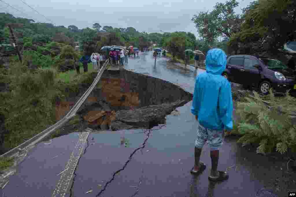 A general view of a collapsed road caused by flooding waters due to heavy rains following cyclone Freddy in Blantyre, Malawi.